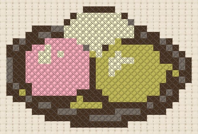 Mochi plate finished in cross stitch on Aida cloth