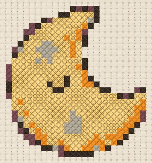 Moon pillow finished in cross stitch on Aida cloth