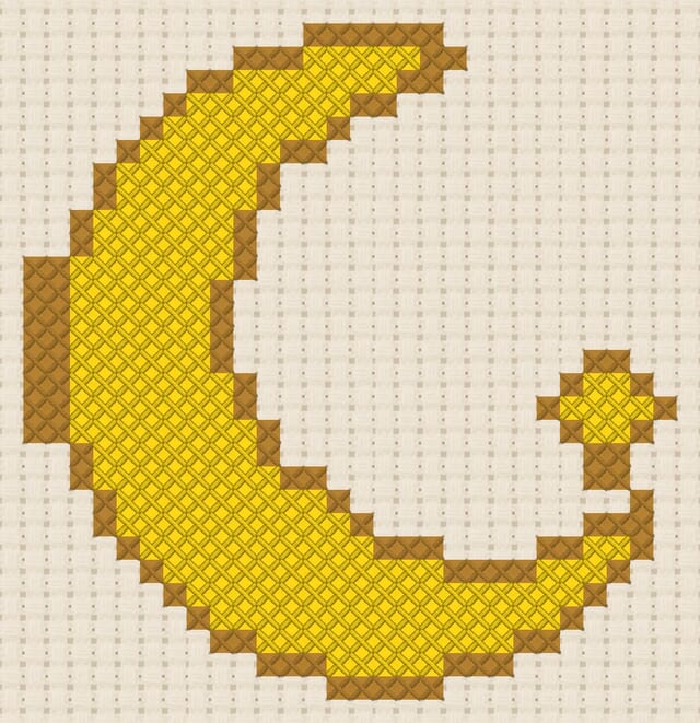 Moon and stars finished in cross stitch on Aida cloth
