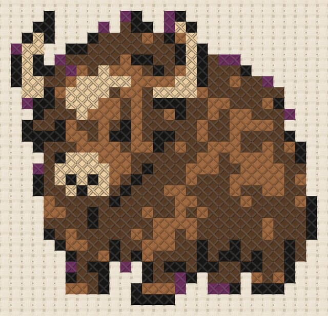 Mountain yak finished in cross stitch on Aida cloth