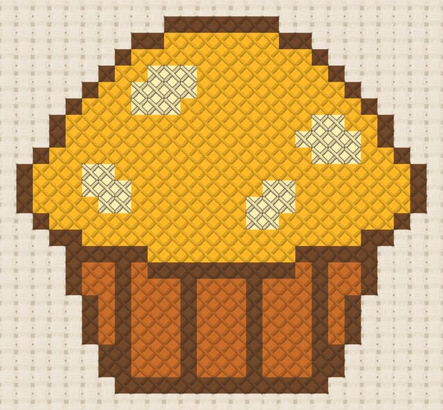 Muffin finished in cross stitch on Aida cloth