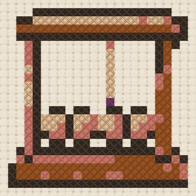 Newton cradle finished in cross stitch on Aida cloth