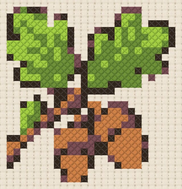 Oak branch finished in cross stitch on Aida cloth