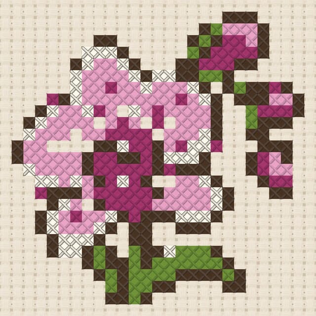 Orchid finished in cross stitch on Aida cloth