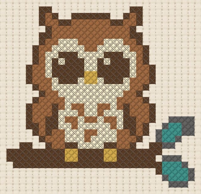Owl on a branch at night finished in cross stitch on Aida cloth
