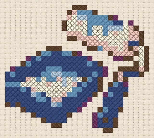 Paint roller finished in cross stitch on Aida cloth
