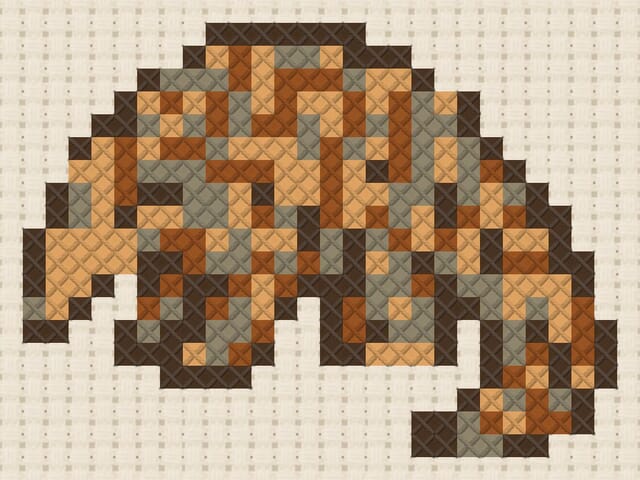 Pangolin finished in cross stitch on Aida cloth