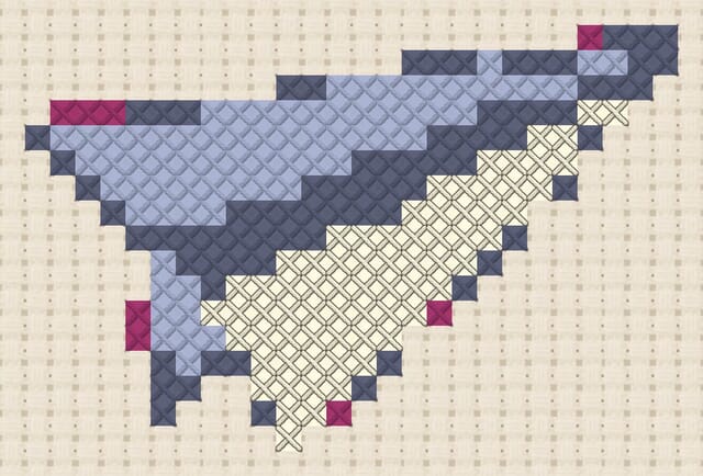 Paper glider finished in cross stitch on Aida cloth