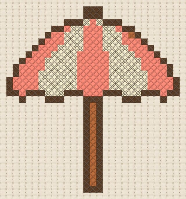 Beach umbrella finished in cross stitch on Aida cloth
