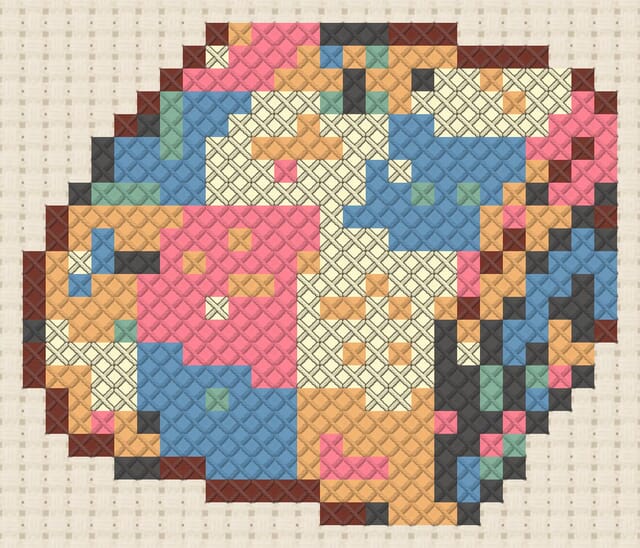 Patchwork quilt finished in cross stitch on Aida cloth