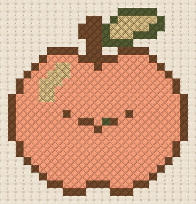 Peach finished in cross stitch on Aida cloth