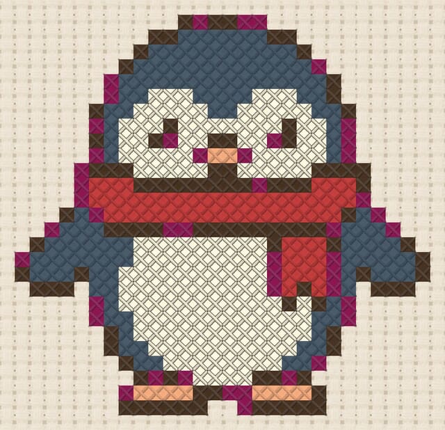 Penguin in scarf finished in cross stitch on Aida cloth