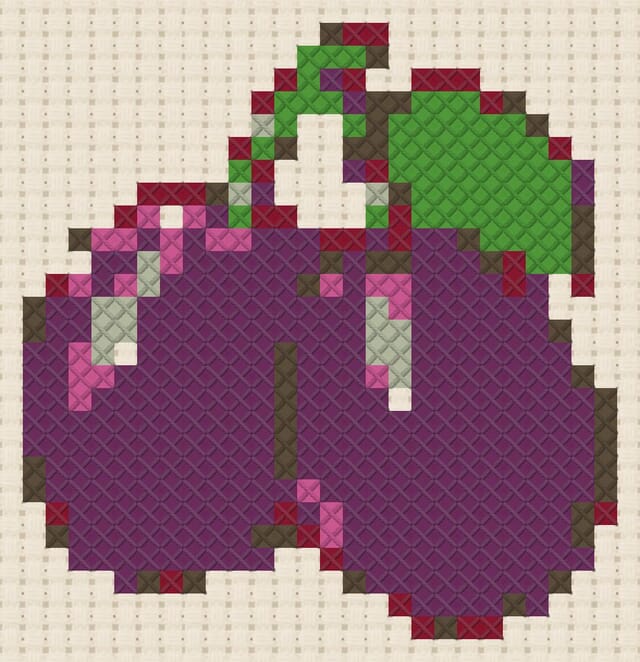 Plum pair finished in cross stitch on Aida cloth