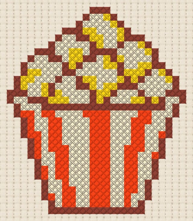 Popcorn box finished in cross stitch on Aida cloth