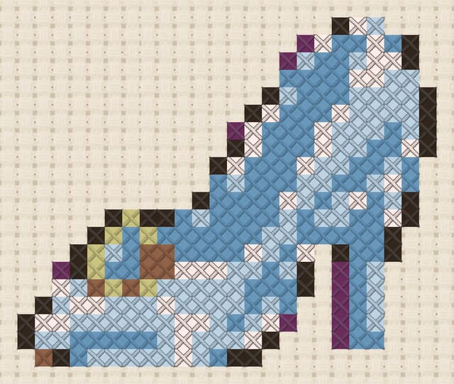 Princess slipper finished in cross stitch on Aida cloth