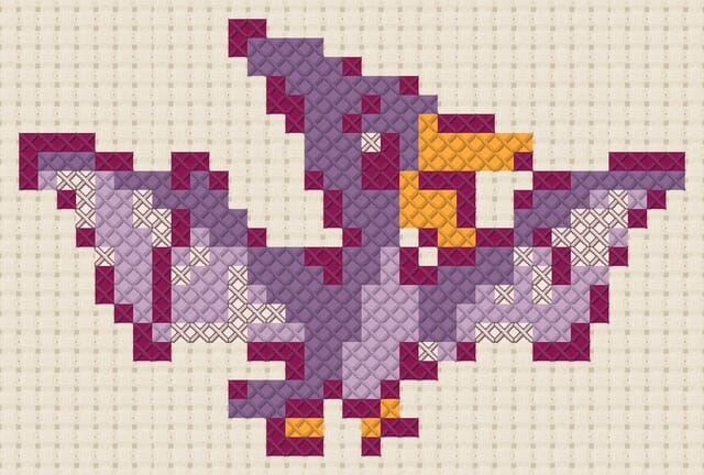 Pterodactyl finished in cross stitch on Aida cloth