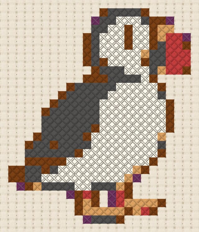 Puffin finished in cross stitch on Aida cloth