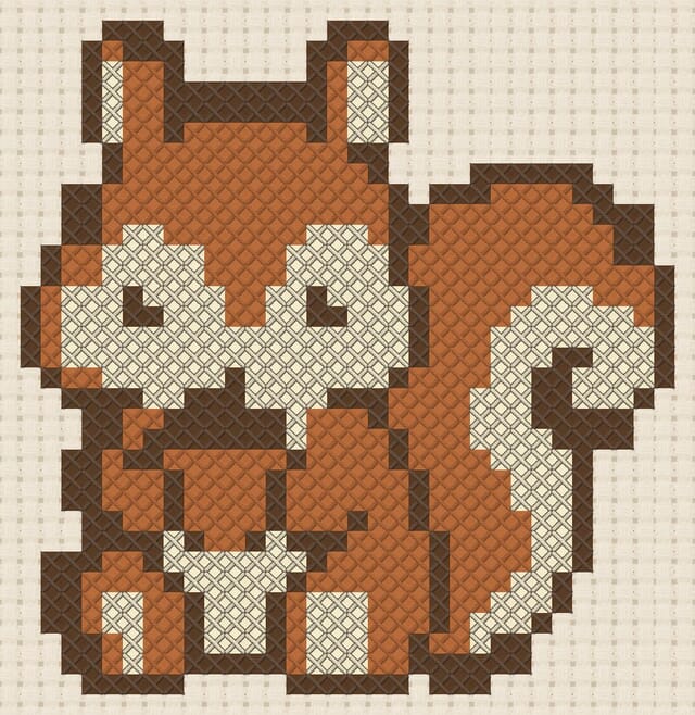 Red squirrel with acorn finished in cross stitch on Aida cloth
