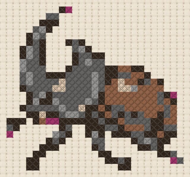 Rhinoceros beetle finished in cross stitch on Aida cloth