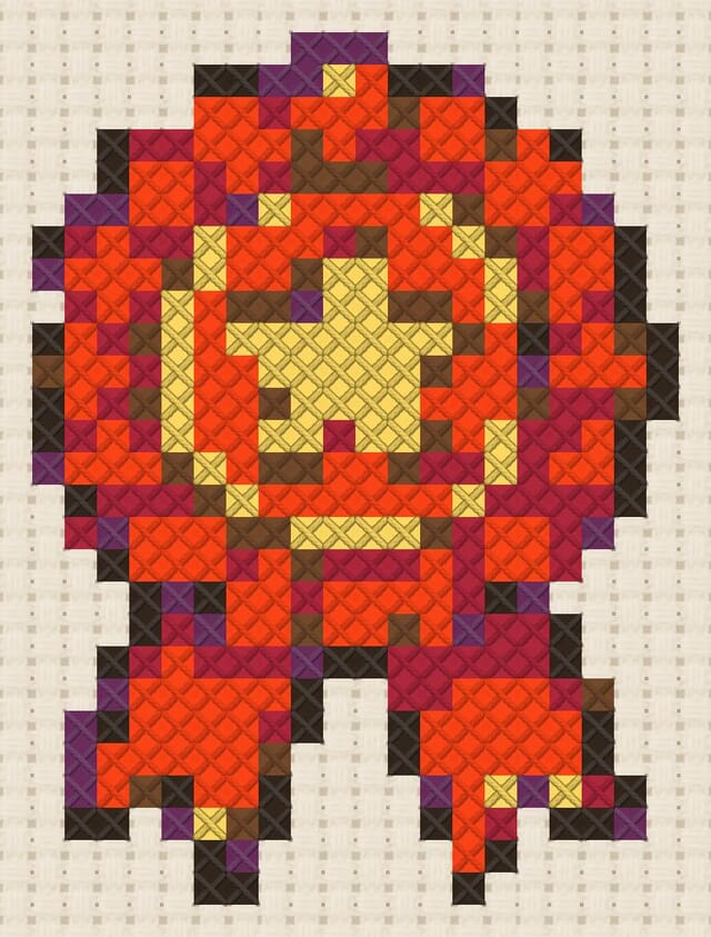 Ribbon rosette finished in cross stitch on Aida cloth
