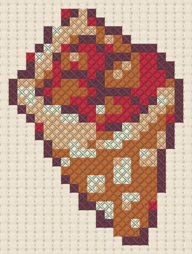 Roasted chestnut cone finished in cross stitch on Aida cloth