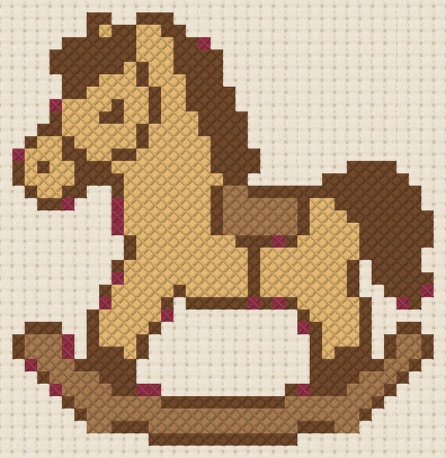Rocking horse finished in cross stitch on Aida cloth