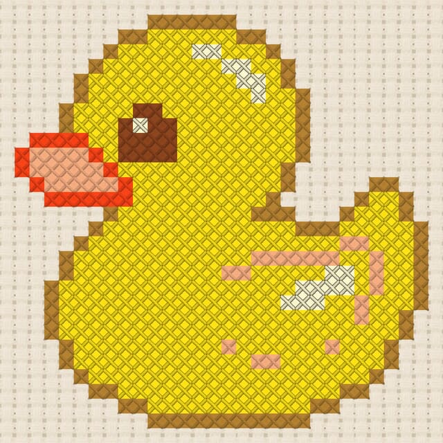 Rubber duck finished in cross stitch on Aida cloth