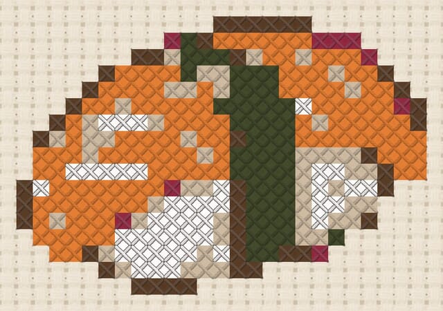 Salmon nigiri finished in cross stitch on Aida cloth