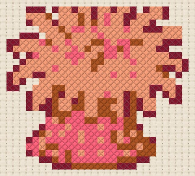 Sea anemone finished in cross stitch on Aida cloth