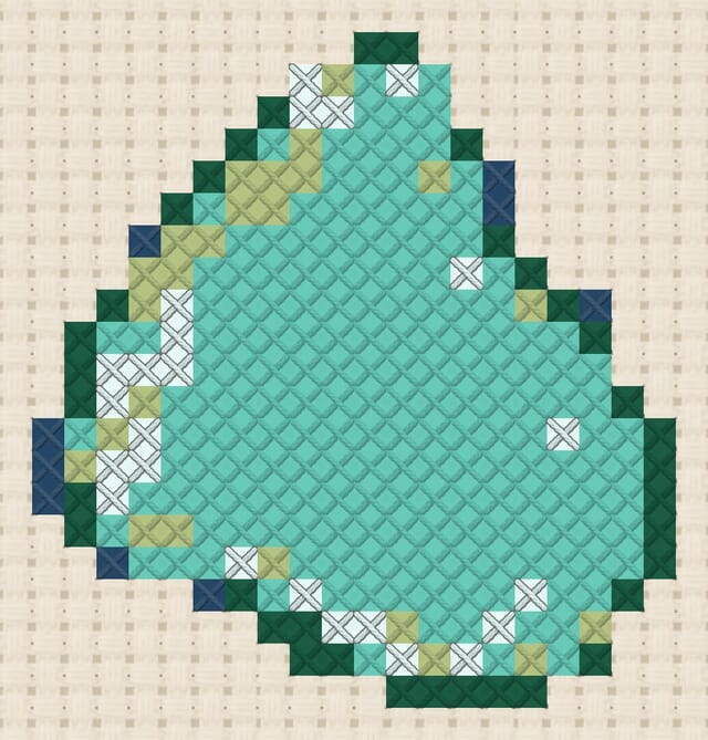 Sea glass finished in cross stitch on Aida cloth