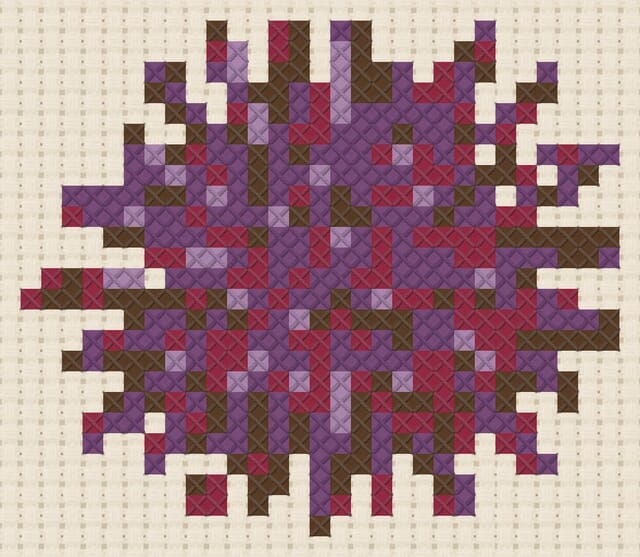 Sea urchin finished in cross stitch on Aida cloth