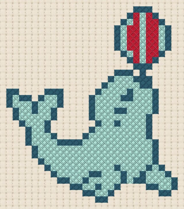 Seal with ball finished in cross stitch on Aida cloth