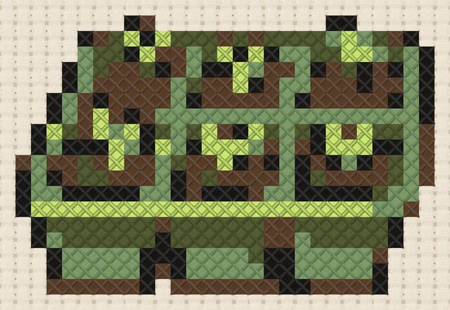 Seed tray finished in cross stitch on Aida cloth