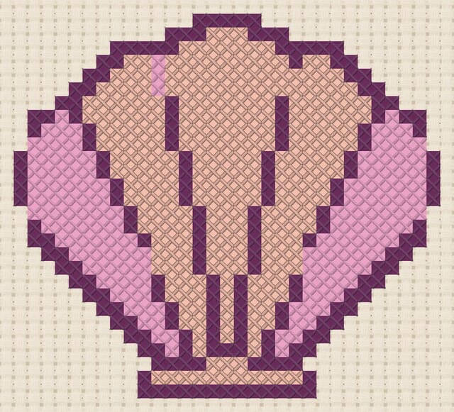 Shell finished in cross stitch on Aida cloth