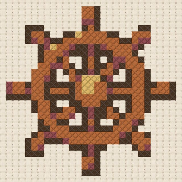 Ship wheel finished in cross stitch on Aida cloth