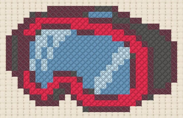 Ski goggles finished in cross stitch on Aida cloth