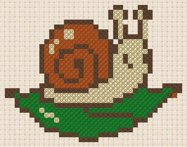 Snail on a leaf finished in cross stitch on Aida cloth