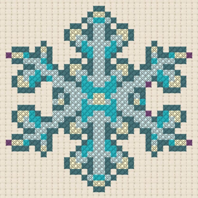 Snowflake finished in cross stitch on Aida cloth
