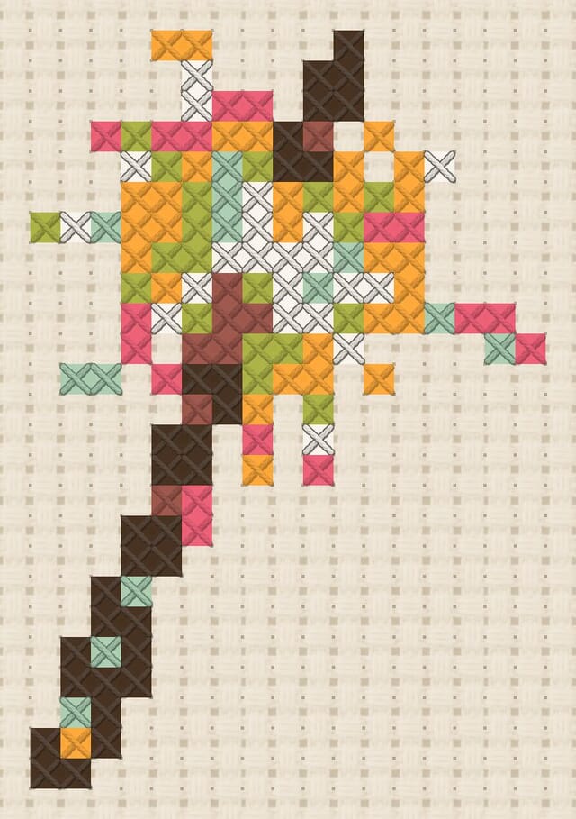 Sparkler finished in cross stitch on Aida cloth