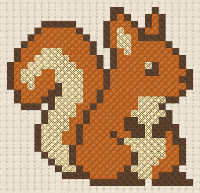 Squirrel finished in cross stitch on Aida cloth