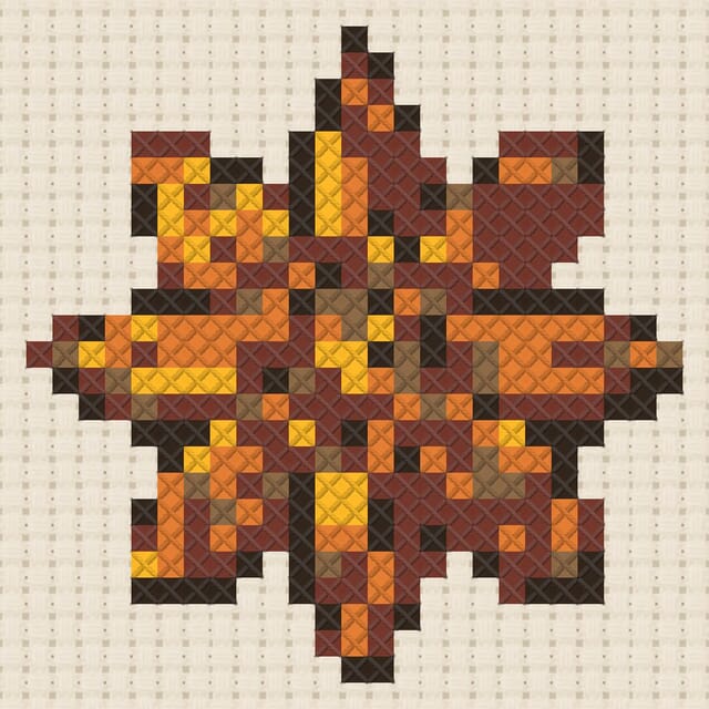 Star anise finished in cross stitch on Aida cloth