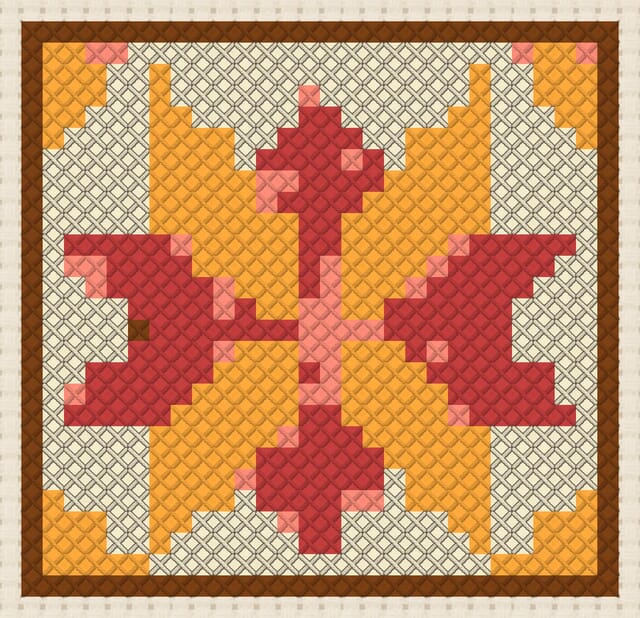 Starburst quilt block finished in cross stitch on Aida cloth