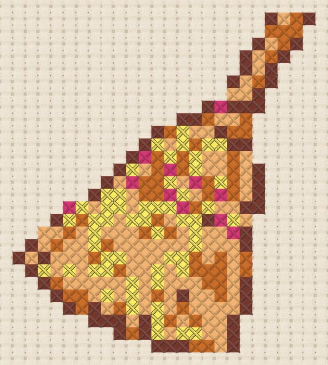 Straw broom finished in cross stitch on Aida cloth