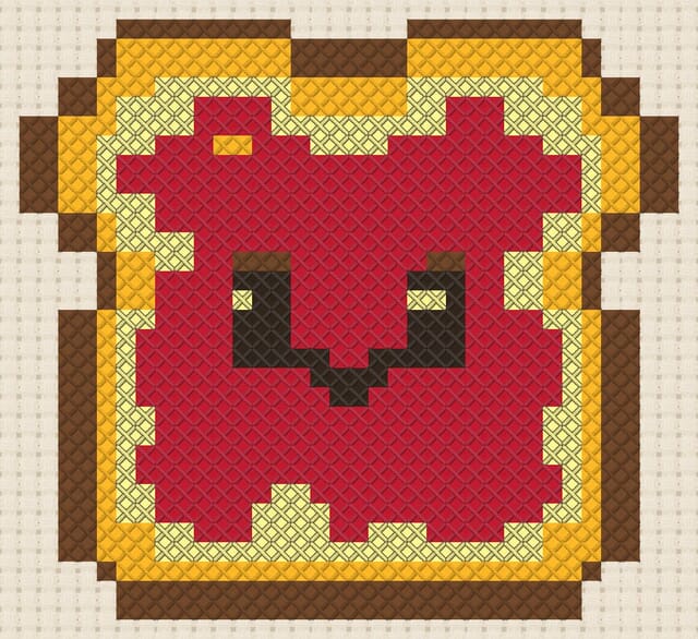 Strawberry jam toast finished in cross stitch on Aida cloth