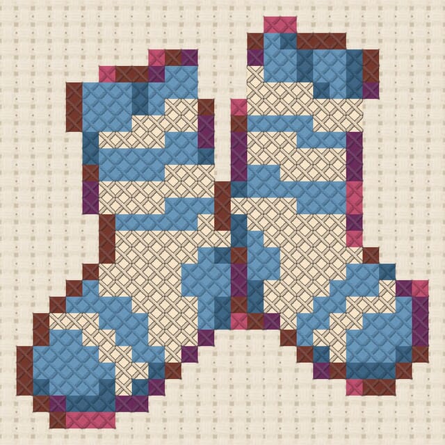 Striped socks finished in cross stitch on Aida cloth
