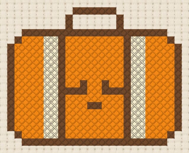Suitcase finished in cross stitch on Aida cloth