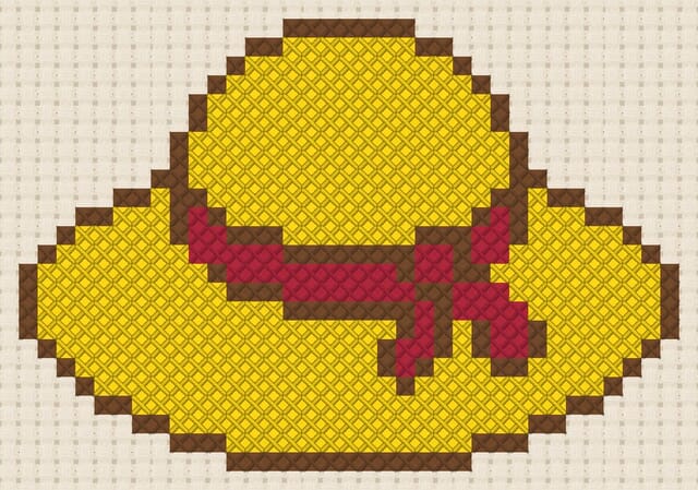Sun hat finished in cross stitch on Aida cloth