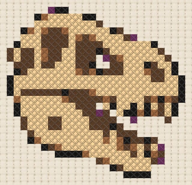 T-rex skull finished in cross stitch on Aida cloth