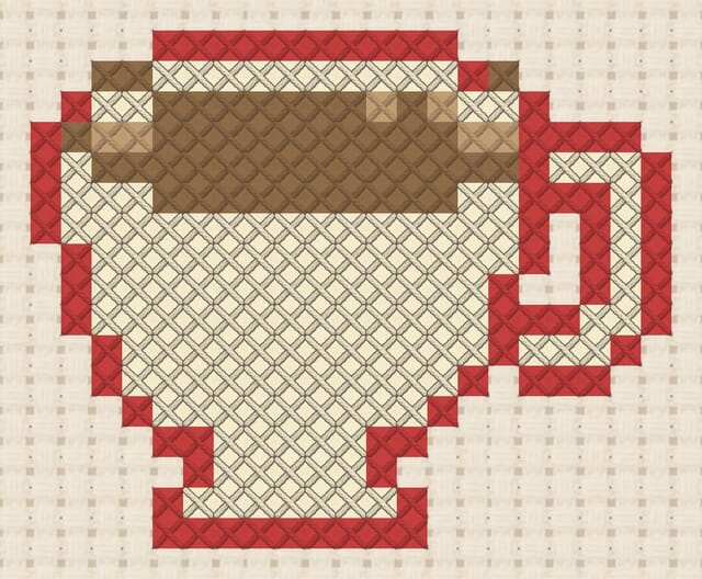Teacup finished in cross stitch on Aida cloth