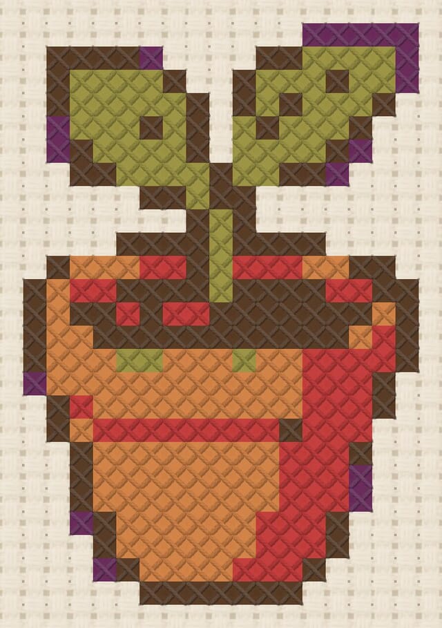 Terracotta seedling finished in cross stitch on Aida cloth